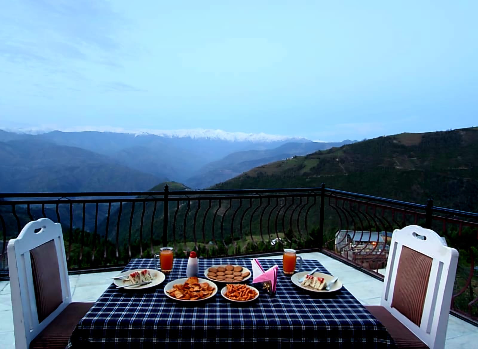 Balcony breakfast with mountain views